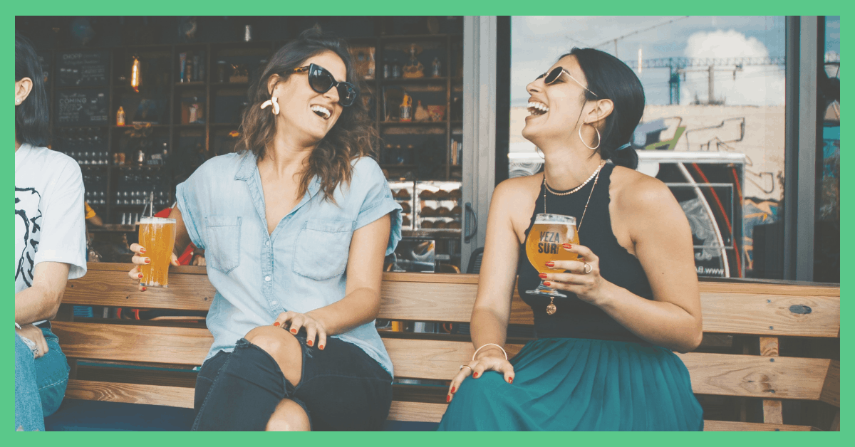 Image shows two friends laughing, drinking beer. the picture has a green border. Used on a post about how to make and save money.